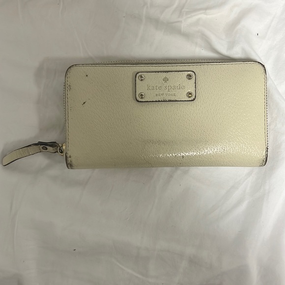 Beige Kate spade large zip around wallet. All damage is shown in pictures. - Picture 1 of 6